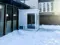 View of 7'6" x 7'6" x 9' pre-assembled welded steel vestibule in snow, with integrated HVAC and electrical package, designed to help protect occupants from extreme cold temperatures.