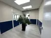 Interior of a small modular room with windows, LVP flooring, and recessed ceilings