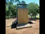 Custom steel military training tower at Georgia Military College with multiple elevated platforms, internal stairs, guardrails, and training areas designed for rappelling and rope-based exercises.