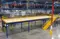 Blue and yellow structural steel mezzanine engineered by panel built for a manufacturing facility 