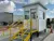 Exterior view of a portable cooling booth with stairs in a parking lot to provide a cool space for workers in hot environments