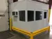External view of a Panel Built multi-person inplant cooling room installed inside a factory and protected by guard rails